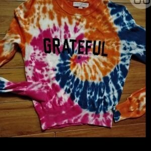 Bright orange knit top by Spiritual Gangster. Soft anColorful Tie-Dye Sweatshirt